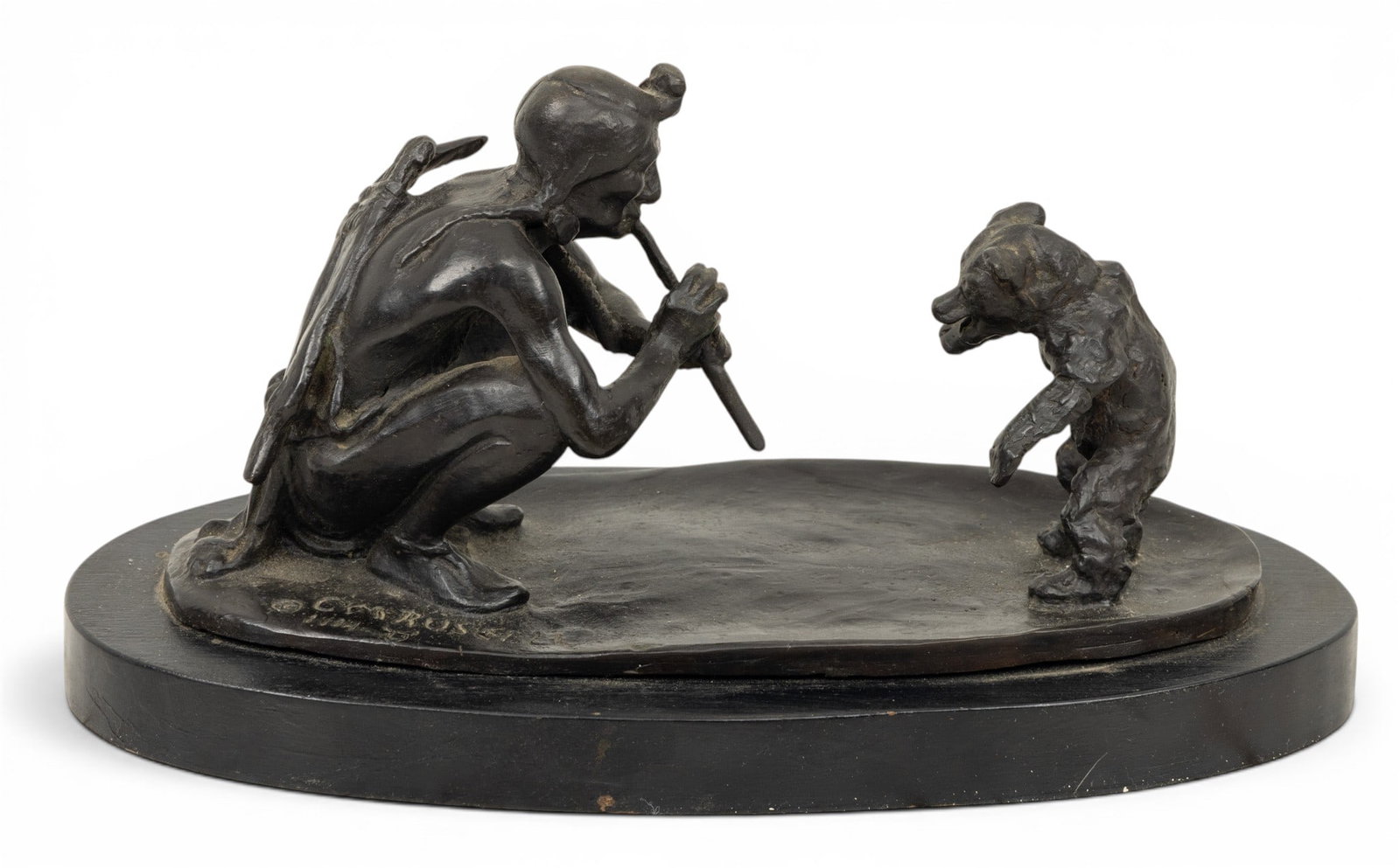 After Charles Marion Russell (American, 1864-1926) Bronze Sculpture 20th C., 'Native American with: After Charles Marion Russell (American, 1864-1926) Bronze Sculpture 20th C., 'Native American with Dancing Bear', H 4.25" W 3" L 8" Dark brown patina bronze sculpture depicting a Native American playi