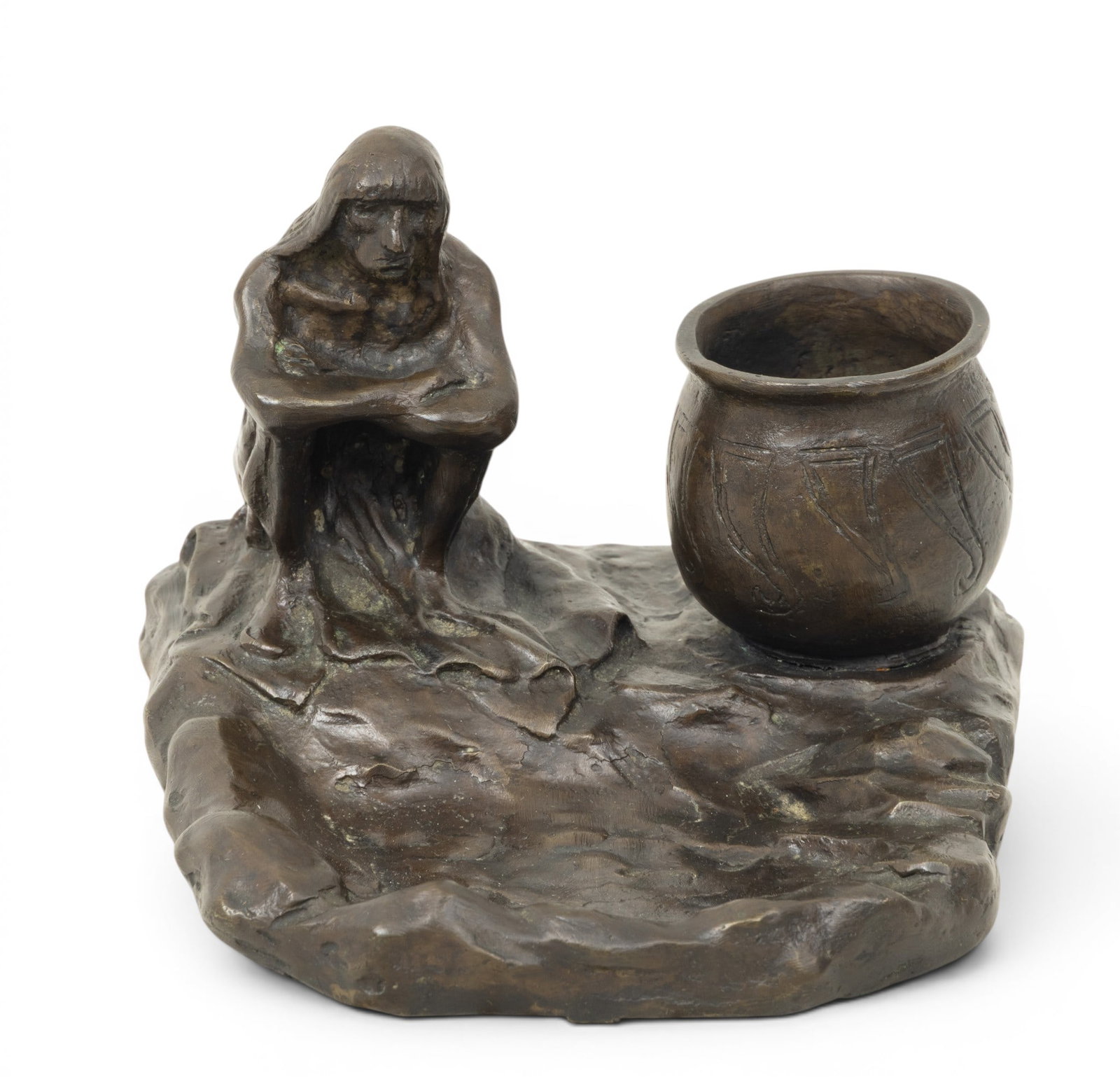 After Charles Marion Russell (American, 1864-1926) Bronze Desk Accessory 20th C., 'Native American: After Charles Marion Russell (American, 1864-1926) Bronze Desk Accessory 20th C., 'Native American by a Pool of Water', H 3.5" W 5" Depth 6" Signed. Partial foundry mark. Depicting a Native American f