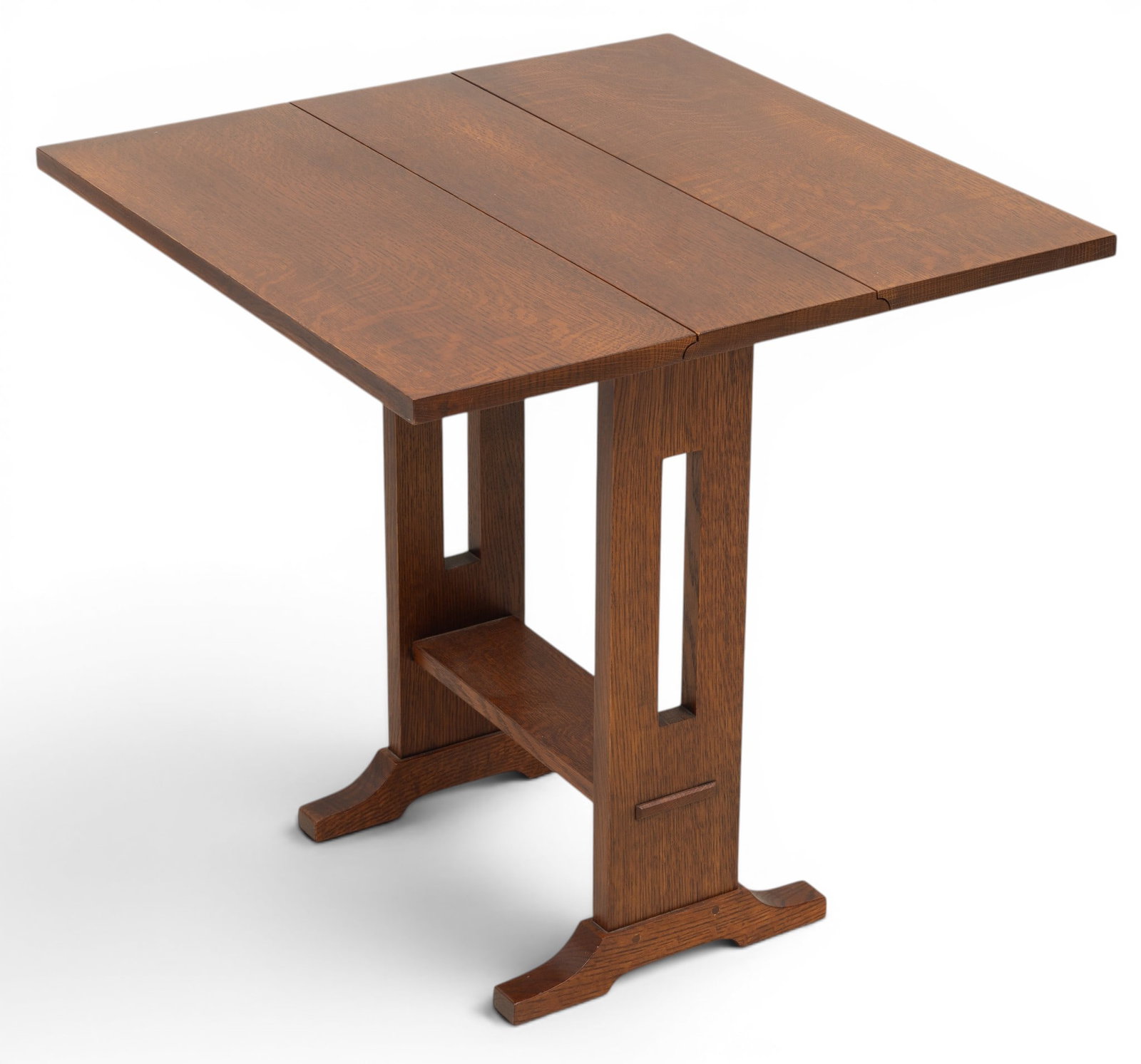 Stickley (American) Mission Style Oak Drop-Leaf Table H 24.5" W 7.5" Depth 24": Stickley (American) Mission Style Oak Drop-Leaf Table H 24.5" W 7.5" Depth 24" Quarter sawn oak, rectangular tops with hinged drop leaves, raised on pierced supports with stretcher base terminating in