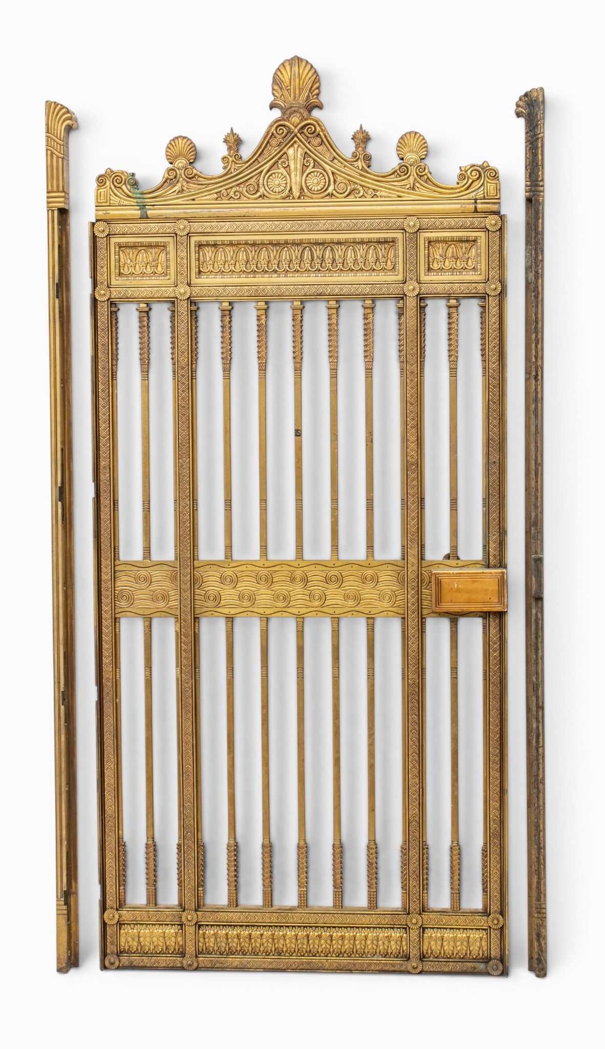 American Architectural Bronze Bank Gate 1920's, H 72.5" W 32.5": American Architectural Bronze Bank Gate 1920's, H 72.5" W 32.5" Shell and scrolling leaf designs. Provenance: Property from a Bloomfield Hills, MI private collector Dimensions: H 72.5" W 32.5" |