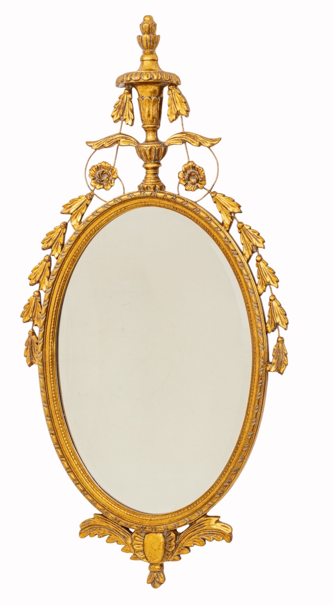 Federal Style Oval Gilt Wall Mirror 1960, H 50" W 24" 1 PC: Federal Style Oval Gilt Wall Mirror 1960, H 50" W 24" 1 PC Urn form finial, cascading flowers trailing down sides. Dimensions: H 50" W 24" 1 PC