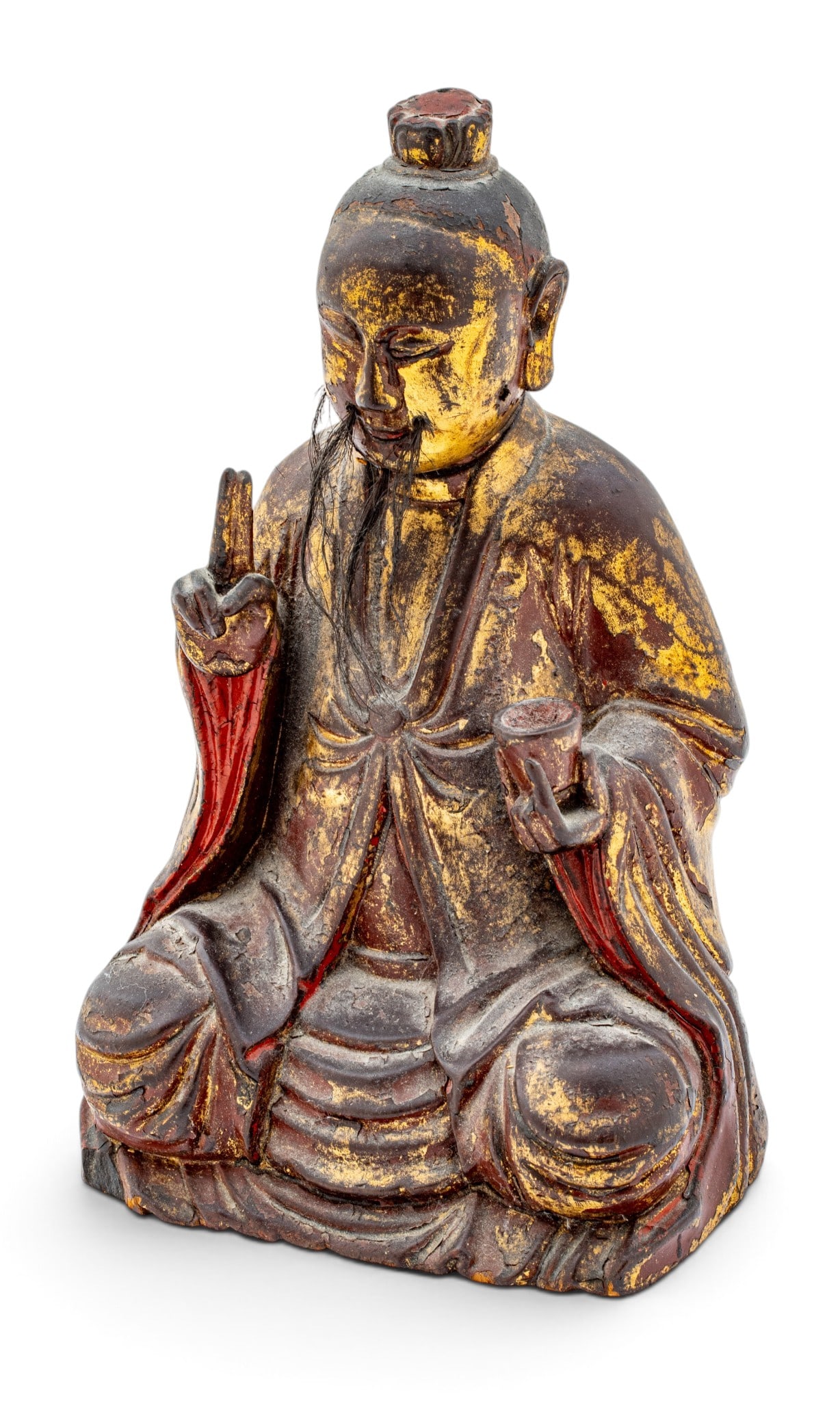 Chinese Carved Gilt Lacquer and Wood Figure, Ca. 17th/18th C., H 10" W 6.25" Depth 5": Chinese Carved Gilt Lacquer and Wood Figure, Ca. 17th/18th C., H 10" W 6.25" Depth 5" A seated figure with left hand raised and middle and index figure pointed up, his right hand holding a cup. Horseh