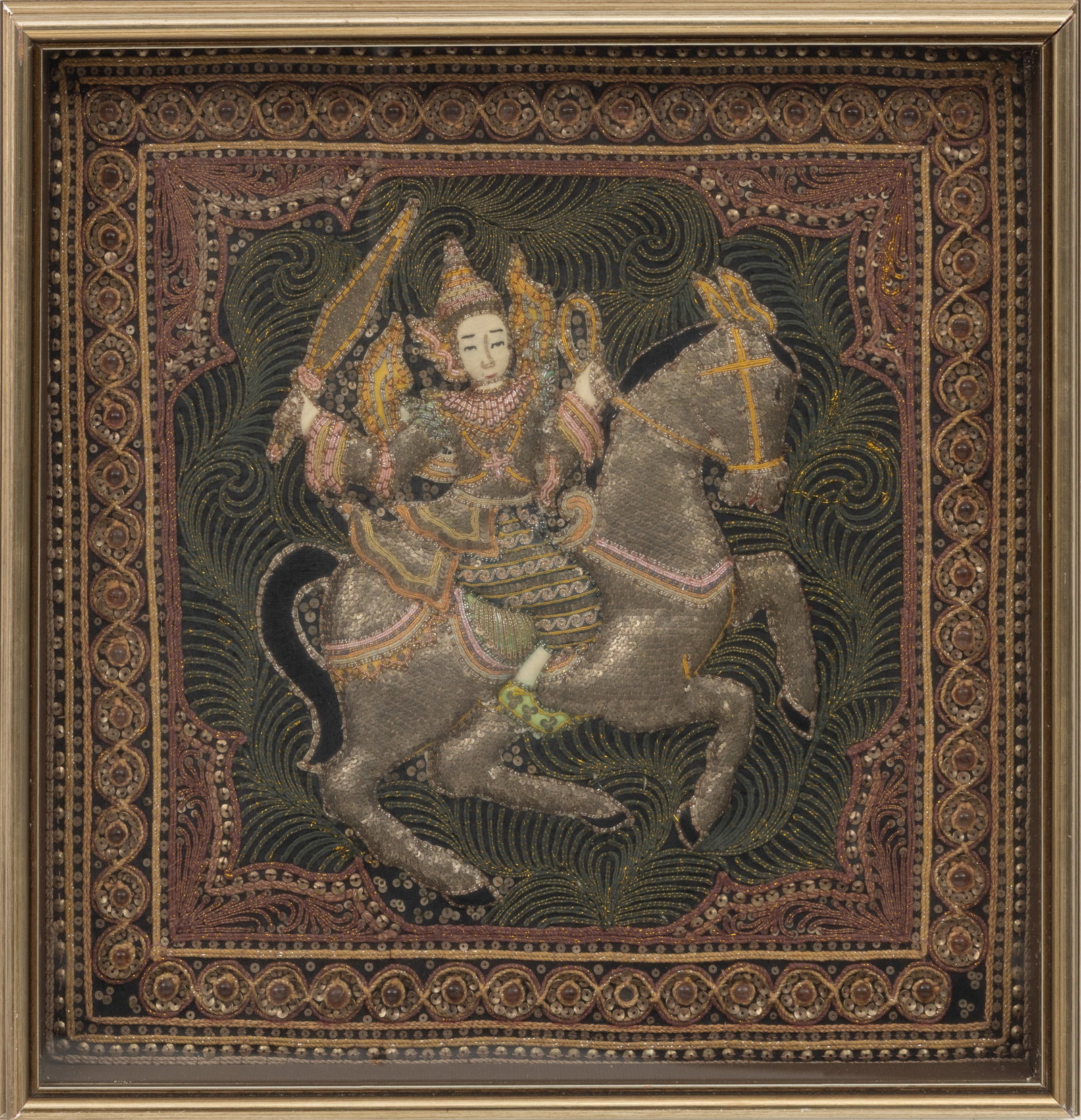 Burmese Sequin and Beadwork Kalaga, Ca. 1920, H 18" W 18": Burmese Sequin and Beadwork Kalaga, Ca. 1920, H 18" W 18" Depicting a mounted warrior holding he sword aloft. Wood silvered frame. eavily embellished appliqué with padded elements, metalli