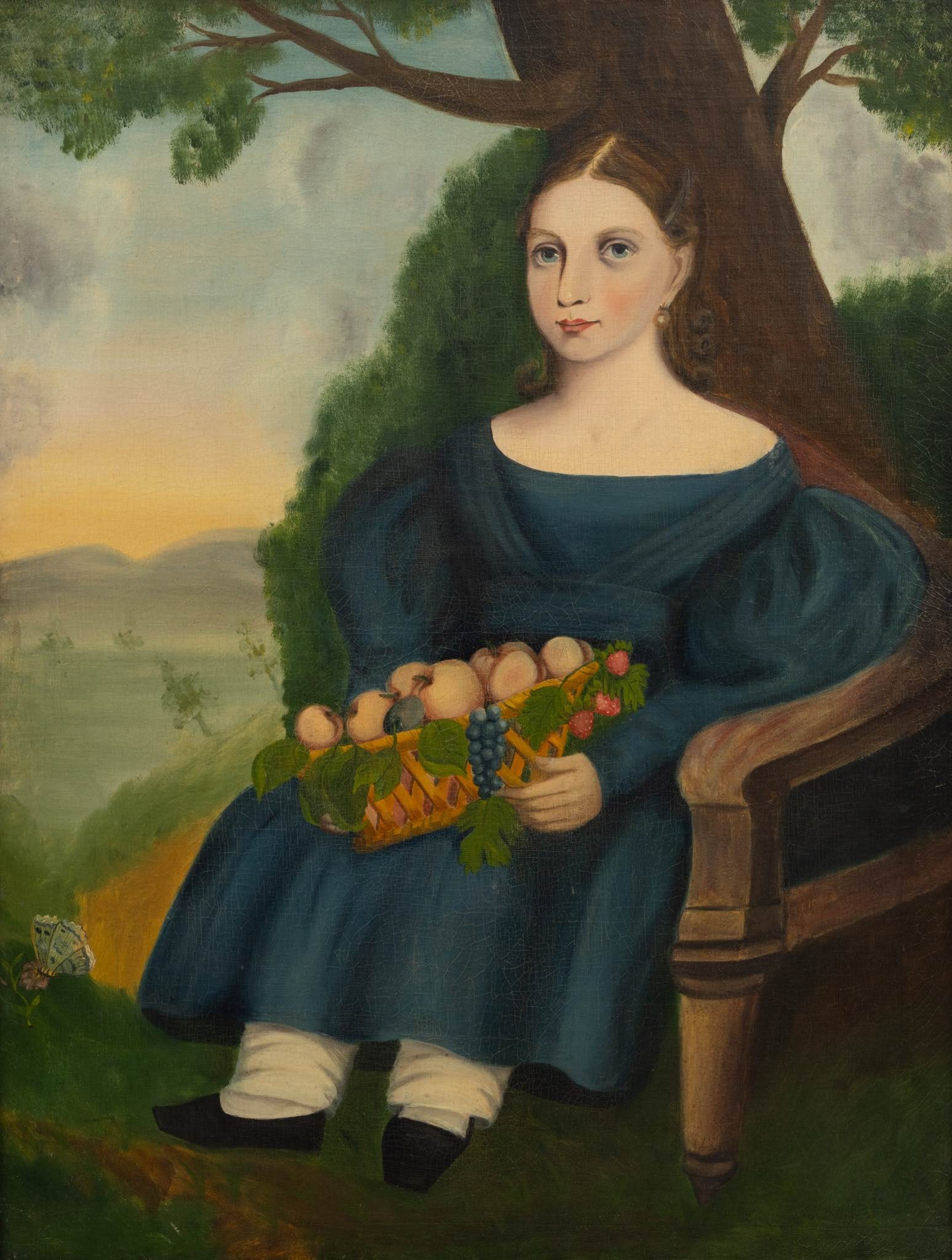 Primitive Oil on Canvas 'Portrait of a Young Woman in Blue Dress', H 33.5" W 25.5": Primitive Oil on Canvas 'Portrait of a Young Woman in Blue Dress', H 33.5" W 25.5" Unsigned. Full length portrait of a seated young woman in a blue dress, holding a basket of fruit in her lap. Having 
