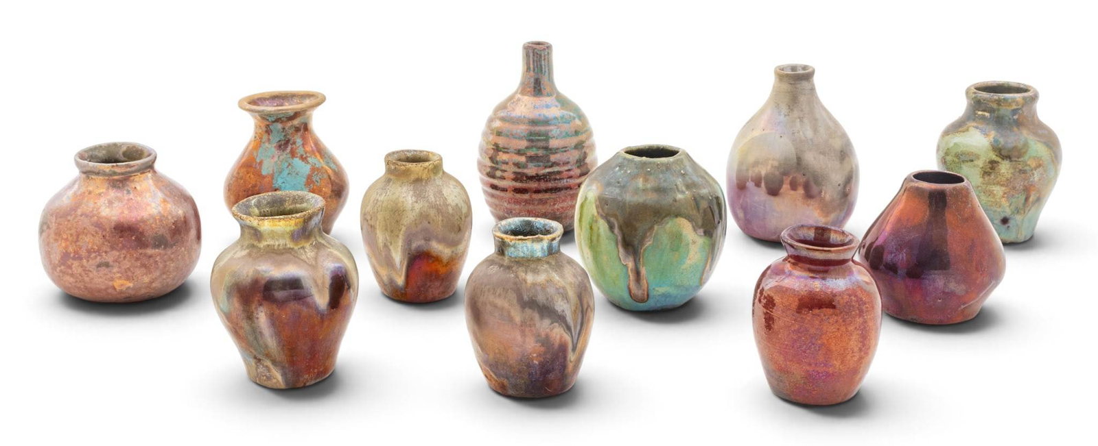 Ira and Ella Peters for Pewabic Pottery (Detroit, Est. 1903) Iridescent Reduction Glazed Bud Vases,: Ira and Ella Peters for Pewabic Pottery (Detroit, Est. 1903) Iridescent Reduction Glazed Bud Vases, Ca. 1970's, 11 PCS Iridescent reduction glazes bud vases. Sizes range; H 2.25"- 3.5". Seven vases ar