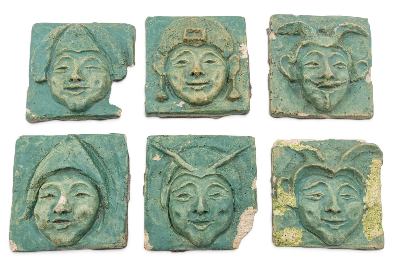 Pewabic Pottery (Detroit, Est. 1903) Glazed Ceramic Theatre Mask Tiles, from the Lobby of the: Pewabic Pottery (Detroit, Est. 1903) Glazed Ceramic Theatre Mask Tiles, from the Lobby of the National Theatre, Detroit, Ca. 1910, H 5.75" W 5.5" 6 PCS Six relief theatre mask tiles with a teal glaze.