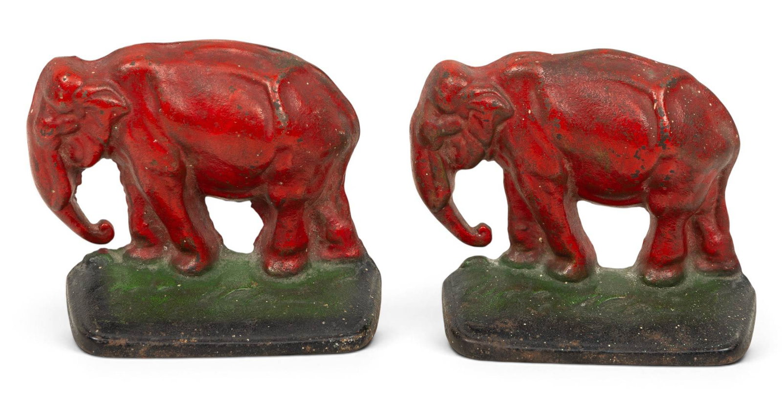 Cast Iron Painted Elephant Bookends, Ca. 1890, H 4" W 4.5" Depth 2": Cast Iron Painted Elephant Bookends, Ca. 1890, H 4" W 4.5" Depth 2" A pair of painted elephant bookends. Red bodies with green bases. Original paint. Provenance: Property from the personal colle