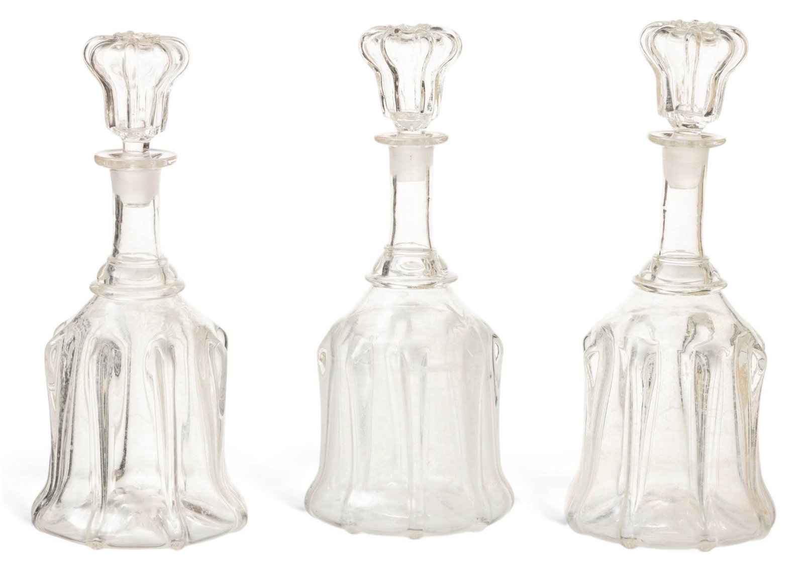 English Victorian Bell Shaped Mold Blown Glass Decanters 1840-1860, H 11" Dia. 4.5" 3 PCS: English Victorian Bell Shaped Mold Blown Glass Decanters 1840-1860, H 11" Dia. 4.5" 3 PCS Three identical decanters with mold blown bell form bases, ring necks, and hollow conforming stoppers. P
