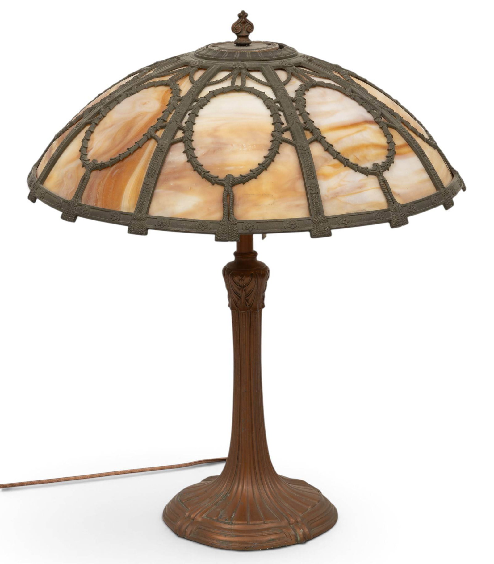 American Eight Paneled Slag Glass Lamp, Ca. 1920s, 'Swag and Wreath', H 22" Dia. 18": American Eight Paneled Slag Glass Lamp, Ca. 1920s, 'Swag and Wreath', H 22" Dia. 18" Having arched eight panels with swag and wreath metal design. Patinated metal base. Electrified. Provenance: Grosse