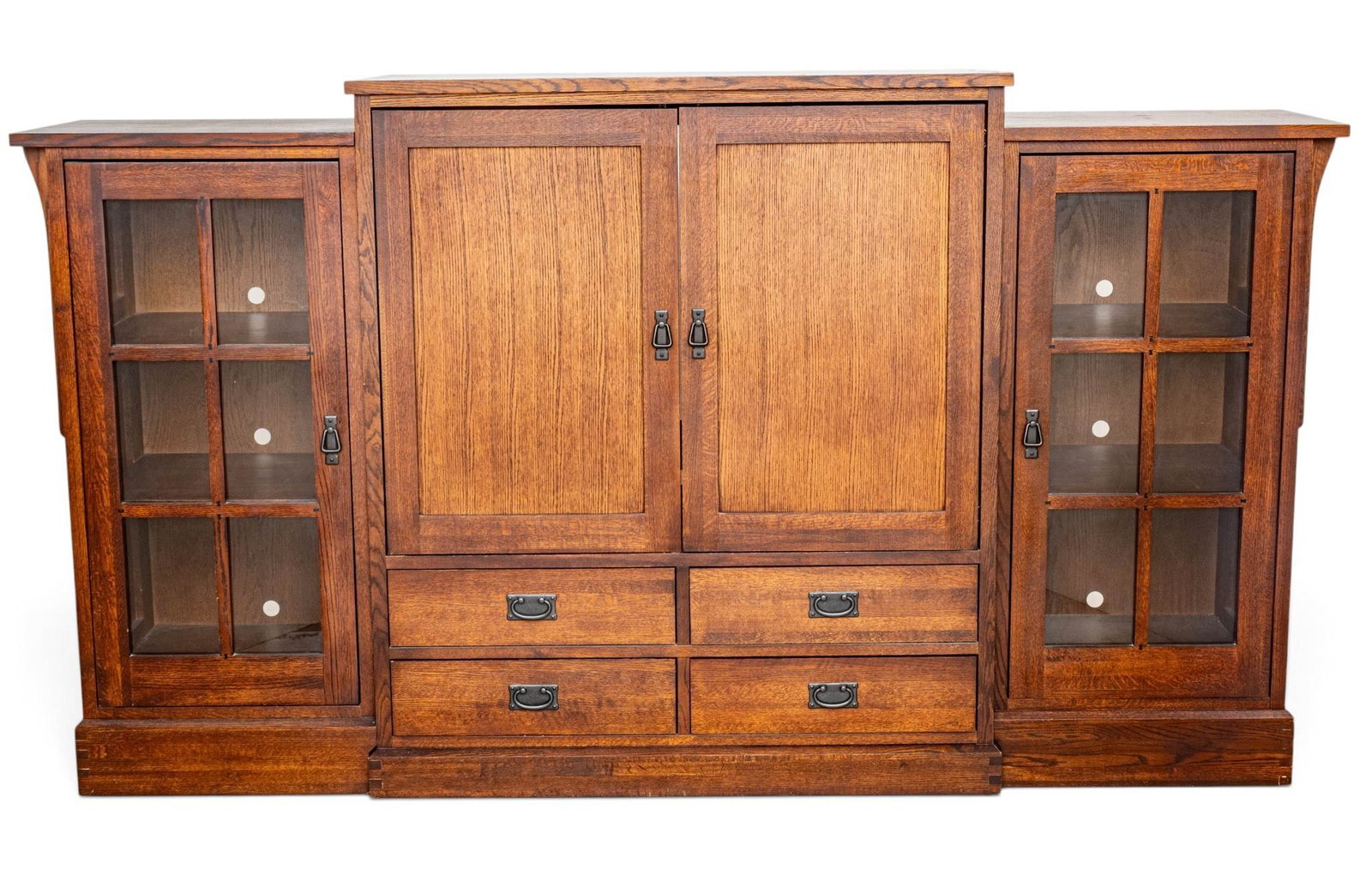 Mission Style Media Center H 54" W 98" Depth 23": Mission Style Media Center H 54" W 98" Depth 23" A central entertainment center with hinged double doors above four drawers, flanked by a bookshelf on either end with hinged doors which open to reveal