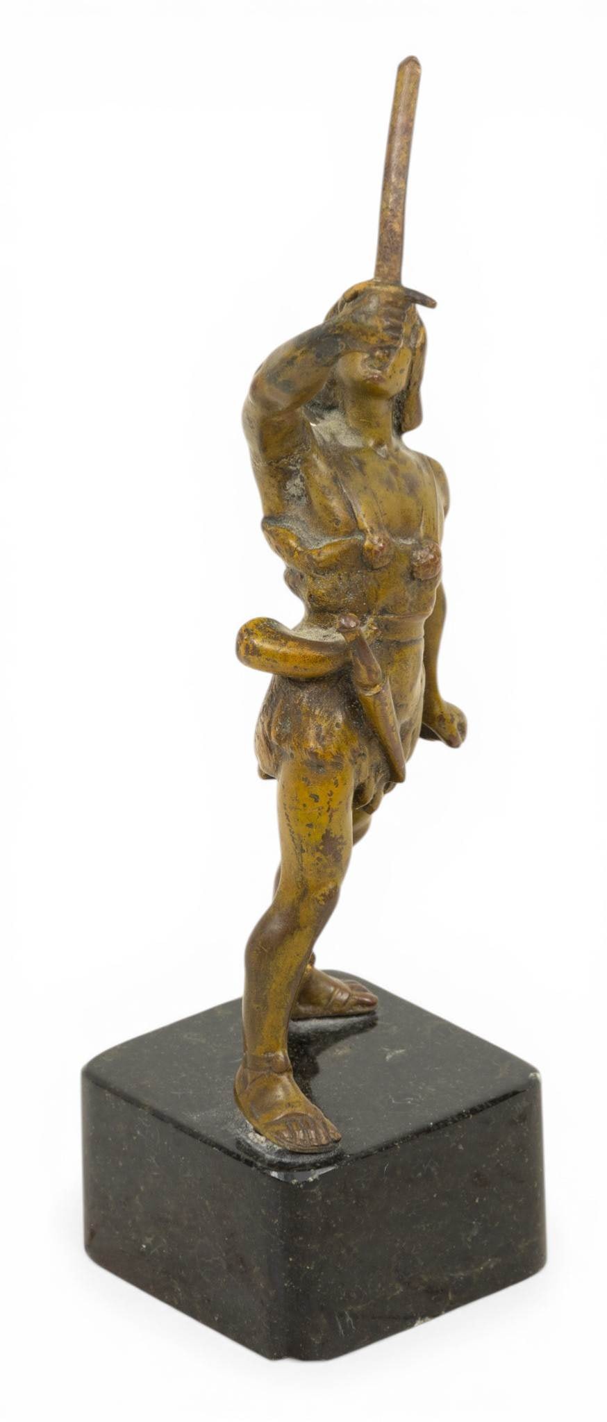French Bronze Miniature 1890-1910, 'Jeanne D'Arc', H 6" W 2" L 2": French Bronze Miniature 1890-1910, 'Jeanne D'Arc', H 6" W 2" L 2" Depicting Jeanne d'Arc standing with her sword uplifted. Unsigned. On a black marble plinth 1.5" X 2" X 2". Provenance: Property