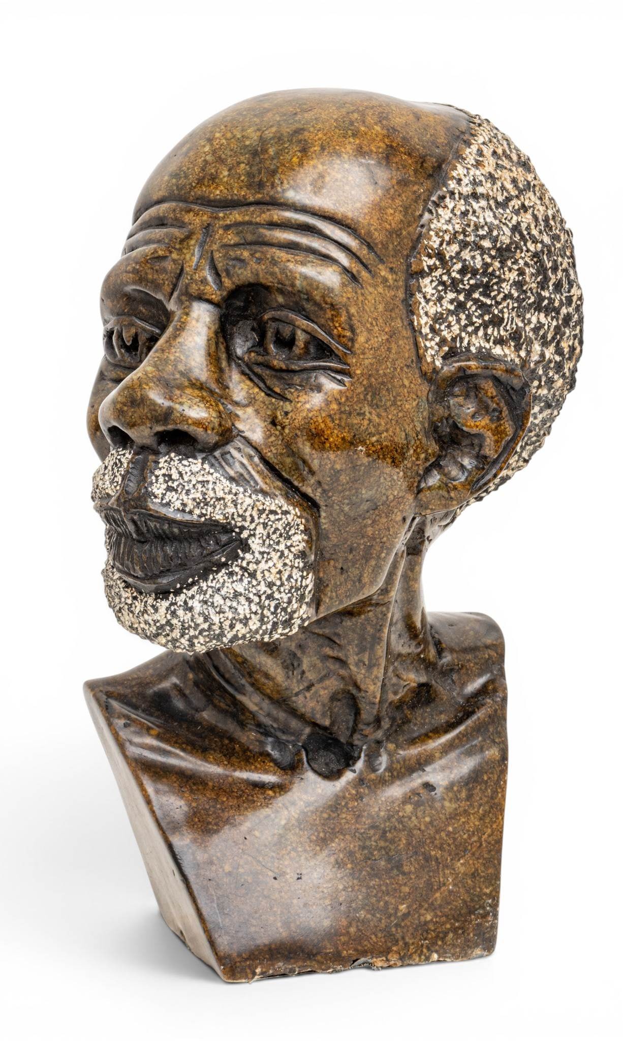 Zimbabwe Shona Carved Stone Sculpture 'Bust of an Elder', H 16" W 11" Depth 7.5": Zimbabwe Shona Carved Stone Sculpture 'Bust of an Elder', H 16" W 11" Depth 7.5" No signature apparent, fine carving. Provenance: Property from a Highland, MI private collector Dimensions: H 16" W 11"