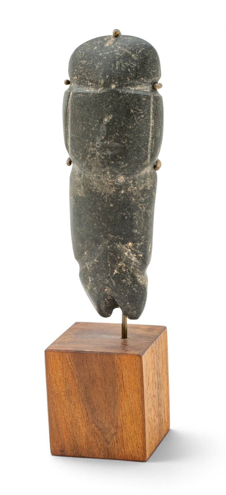 Mezcala Carved Stone Figure H 5.75" W 2": Mezcala Carved Stone Figure H 5.75" W 2" A standing figure carved from black stone. On a wooden stand. Provenance: Property from the Estate Collection of Catherine Mayhew, Bloomfield Hills, MI D