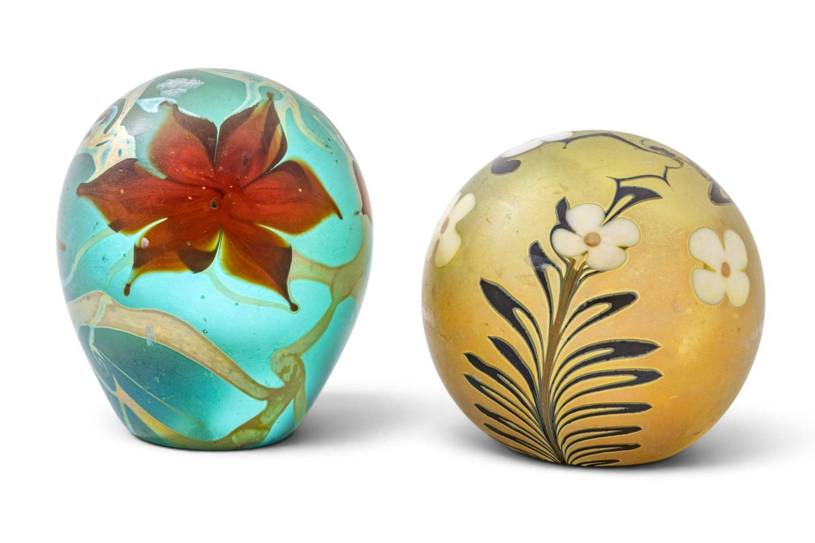 Vandermark Blown Glass Spheres Dia. 3" 2 PCS: Vandermark Blown Glass Spheres Dia. 3" 2 PCS 3" diameter yellow sphere with prunus white flowers and black vines. 1979 signed Vandermark. Oval 4" blown glass weight with red poinsettias against a