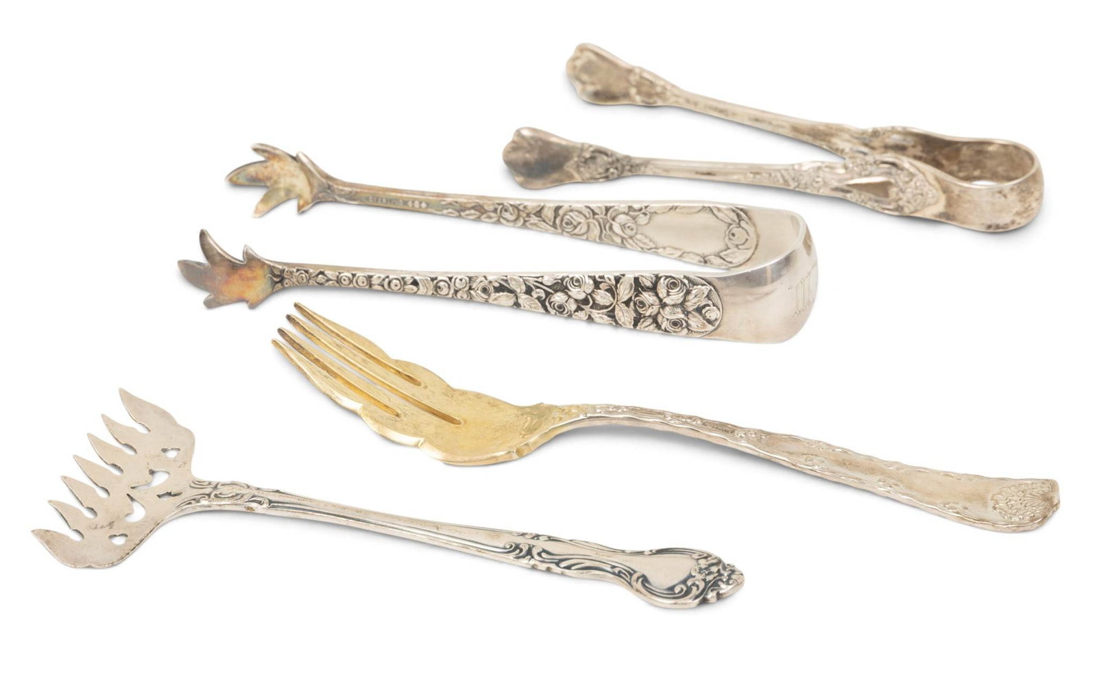 Sterling Silver Flatware by Tiffany, Lunt, Manchester 167 grams 4 PCS: Sterling Silver Flatware by Tiffany, Lunt, Manchester 167 grams 4 PCS Tiffany dessert fork "Wave Edge"41 grams. Pair tongs rococo design 65 grams. Lunt sugar tongs 37grams. Manchester sardine fork