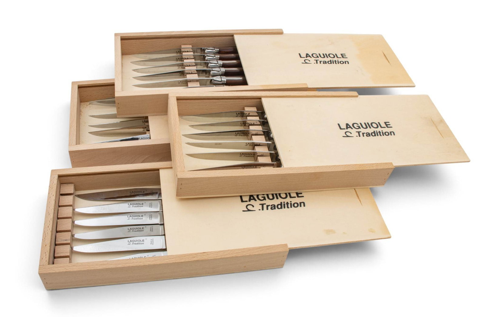Laguiole (French) Stainless Steel and Rosewood Steak Knives 20th C., L 9" 24 PCS: Laguiole (French) Stainless Steel and Rosewood Steak Knives 20th C., L 9" 24 PCS Having rosewood handles and stainless steel blades. Four sets of six knives. Provenance: Property from a Bloomfie
