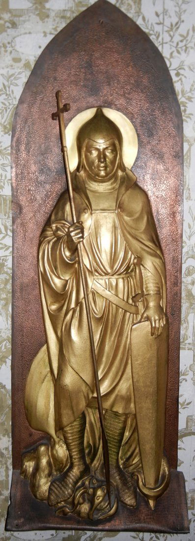 BRASS WALL PLAQUE, JOAN OF ARC, 36" X 12": BRASS WALL PLAQUE, JOAN OF ARC, 36" X 12":Dressed as soldier, wearing a mitre and holding a crozier, standing with fish under foot.