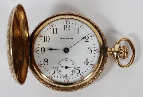 WALTHAM 14KT YELLOW GOLD POCKET WATCH, HUNTER: WALTHAM 14KT YELLOW GOLD POCKET WATCH, HUNTER CASE:#878023. Hunter's case with hinged cover. Circa 1900, T.W. 36.2GR., Case D. 1 3/8", H. 1 3/4"