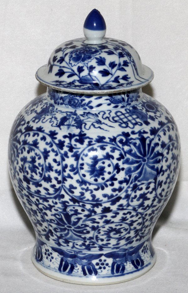 CHINESE PORCELAIN COVERED URN, H 10 1/": CHINESE PORCELAIN COVERED URN, H 10 1/4'', DIA 6 1/2'':Blue and white scrolling leaf and scrolling pattern, four character mark on underside. From a stately Grosse Pointe, Mich. Home.