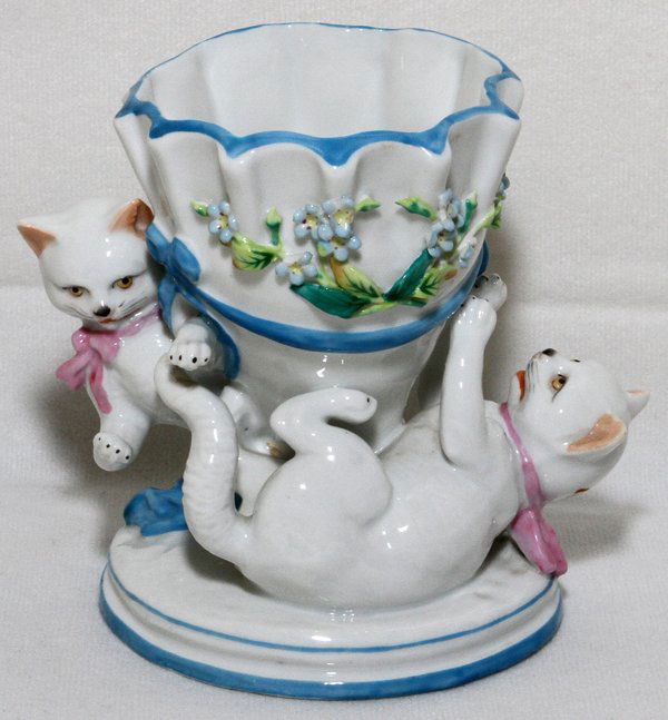 FRENCH PORCELAIN FIGURAL VASE, TWO CATS PLAYING: FRENCH PORCELAIN FIGURAL VASE WITH TWO CATS PLAYING AROUND BASE, H 4 1/2'', L 4 3/4'': From a stately Grosse Pointe, Mich. Home.