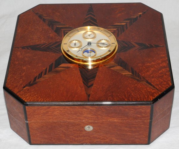 DUNHILL, MARQUETRY INLAY HUMIDOR, H 5", W 14": DUNHILL, MARQUETRY INLAY HUMIDOR, H 5", W 14", D 14":having a burlwood and marquetry inlay humidor, octagonal shape with a clock inset in the lid exhibiting the days, date, month and moon. Temperature