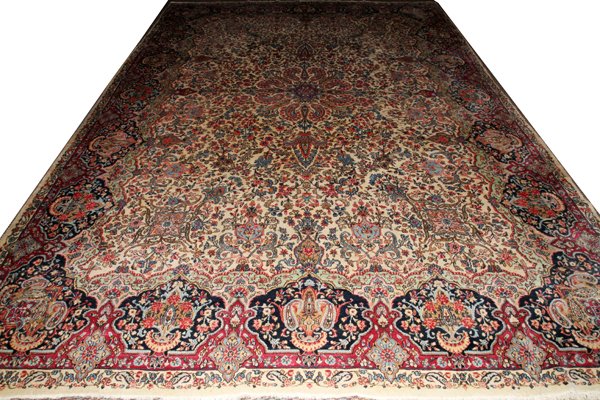 KERMAN PERSIAN CARPET, C. 1900, 15' 0" X 12' 0": KERMAN PERSIAN CARPET, C. 1900, 15' 0" X 12' 0":Ivory field. Closed intricate floral design. Hand woven, all wool. From a Grosse Pointe, Mich. Collector.