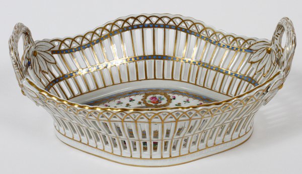 CARL THIEME, DRESDEN PORCELAIN FRUIT BASKET: CARL THIEME, DRESDEN PORCELAIN FRUIT BASKET, H 4'', L 10'':Oval shape flanked by handles, reticulated sides, hand painted with gilding. Marked in blue under glaze for Carl Thieme and Saxonian Porcelai