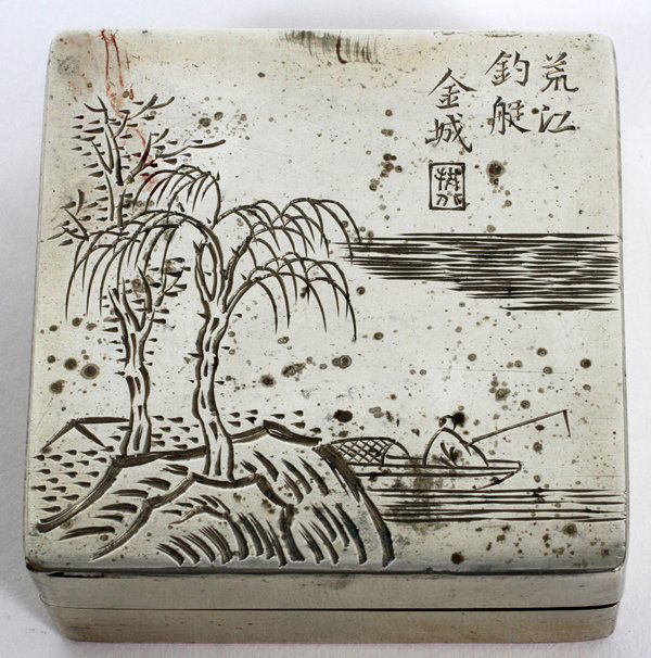 CHINESE SILVER OVER COPPER MEDICINE BOX SIGNED: CHINESE, SILVER OVER COPPER, MEDICINE BOX, SIGNED , H 1", W 2 1/2":Square form. Has calligraphy on cover and signed under box. Boat and fisherman/island and lake design.