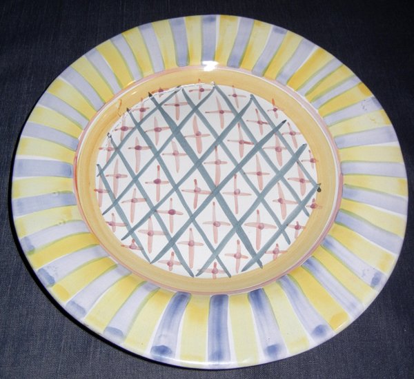 MCKENZIE CHILDS SERVING PLATE: MCKENZIE CHILDS SERVING PLATE, DIA 12":Blue, yellow and salmon in color.