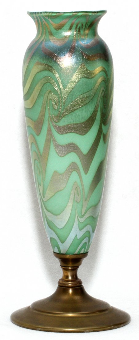 DURAND 'KING TUT' IRIDESCENT GLASS VASE AS LAMP: DURAND 'KING TUT' IRIDESCENT GLASS VASE, EARLY 20TH C., H 8 1/2", MOUNTED AS A LAMP, H 10 1/2" OVER:Green glass vase with pulled silver decoration, mounted on a metal base.