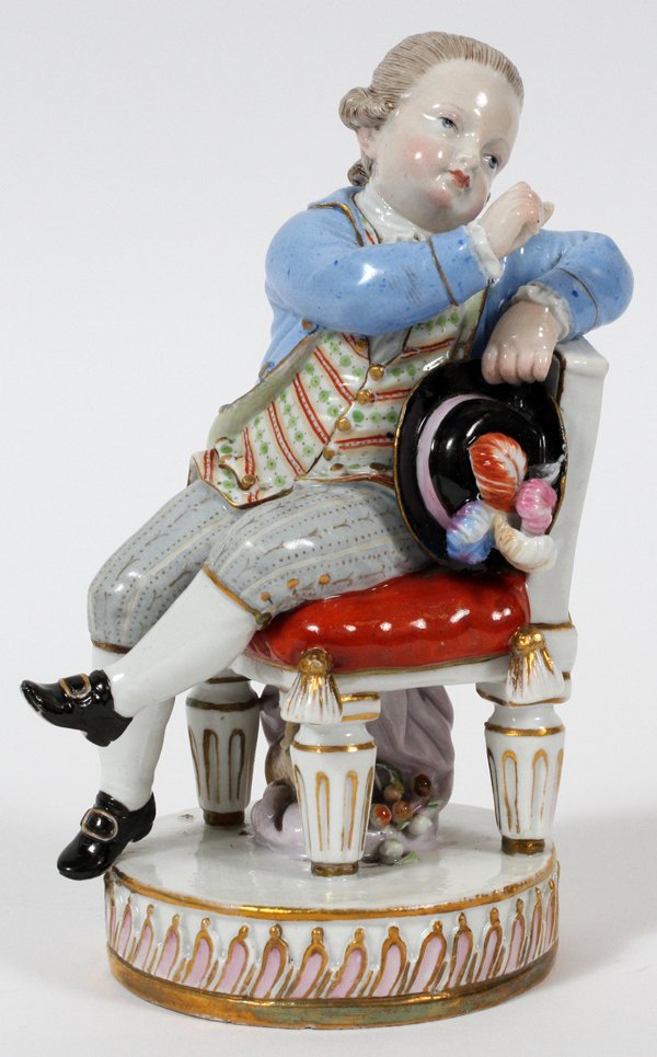 MEISSEN PORCELAIN FIGURE OF A SEATED BOY 19TH C: MEISSEN PORCELAIN FIGURE OF A SEATED BOY, 19TH C., H 5":A boy seated on a chair holding a plumed hat; blue under glaze crossed swords mark, impressed 125, and incised F 57.