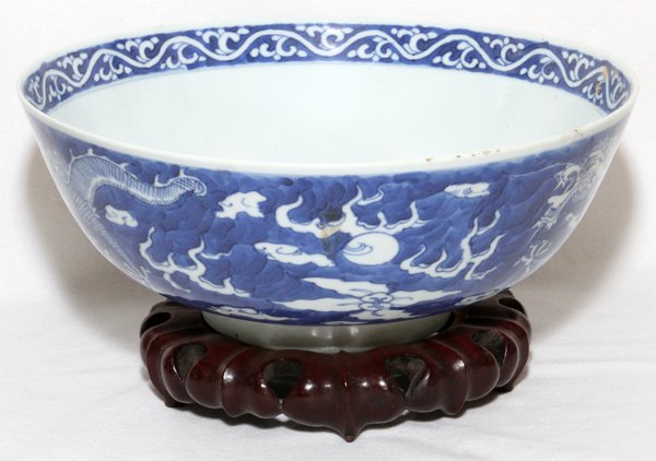 CHINESE MING BLUE & WHITE PORCELAIN BOWL: CHINESE MING BLUE & WHITE PORCELAIN BOWL, DIA 10":Ming four character mark. Cloud and dragon motif. Raised on short foot.