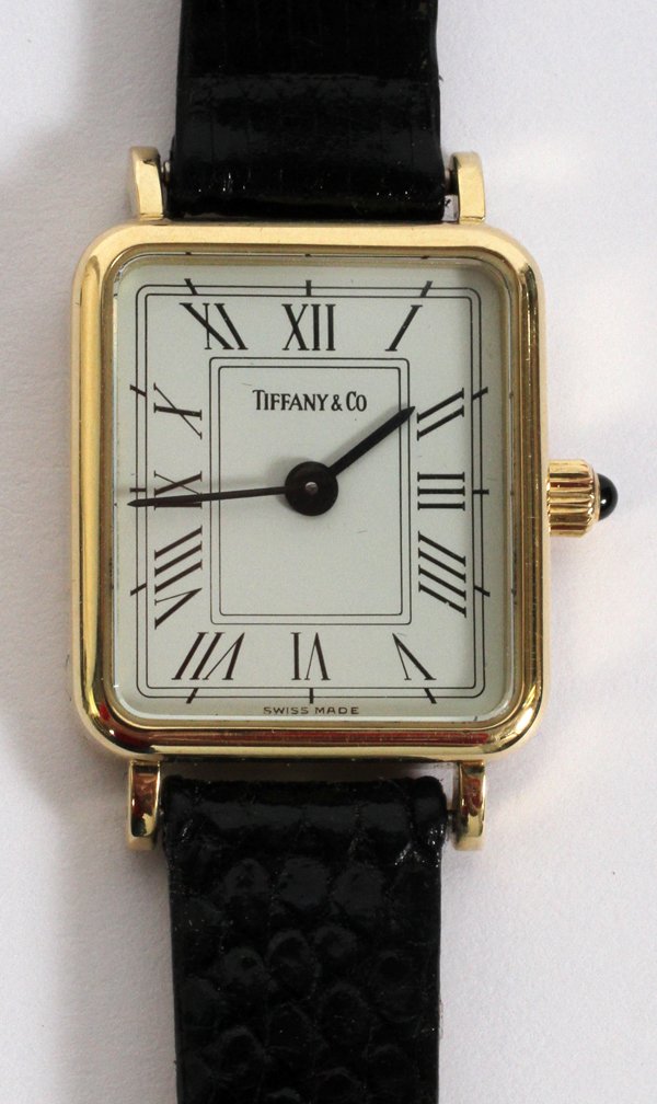 TIFFANY & CO. 14KT YELLOW GOLD LADY'S WRISTWATCH: TIFFANY & CO. 14KT YELLOW GOLD LADY'S WRISTWATCH:Having a newer black lizard band.