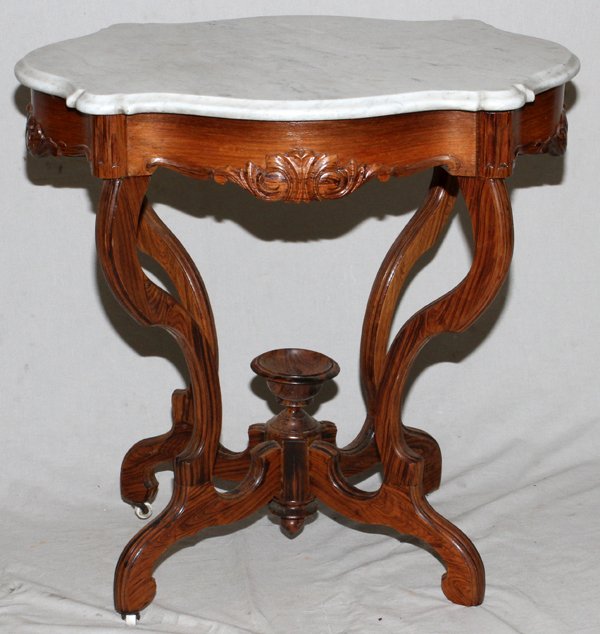 VICTORIAN ROSEWOOD TABLE MARBLE TOP C 1870: VICTORIAN ROSEWOOD TABLE, MARBLE TOP, C 1870 H 30", W 20", L 28":White marble turtle top with beveled edge raised on shaped supports joined by stretchers.