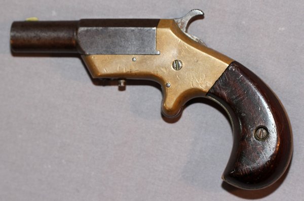 J.M. MARLIN 'VICTOR MODEL' DERRINGER .38 CAL: J. M. MARLIN, 'VICTOR MODEL' DERRINGER, .38 CAL, C1870-80, L 2 3/4" BBL:Single shot .38 Cal. Rimfire, brass framed with rosewood grips. Marked: "J.M. MARLIN / NEW HAVEN, CT. / PAT. APRIL 5, 1870" on s