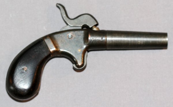 SINGLE SHOT PERCUSSION PISTOL C1850'S: SINGLE SHOT PERCUSSION PISTOL, C1850'S, L 2" BBL:Approximately .28 Cal., 2'' tapered, screw-off barrel, spur trigger and bulb shaped wood grips. No markings present on pistol. C-1850's.