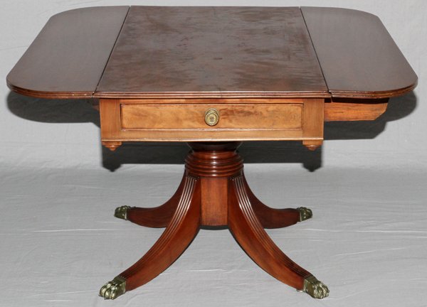 DUNCAN PHYFE STYLE MAHOGANY DROP LEAF TABLE: DUNCAN PHYFE STYLE, MAHOGANY, DROP LEAF TABLE, H 27" W 24", (44" LEAVES OPEN), D 24":having two drop leaves with a drawer on the side with brass pull. Pedestal base with curved legs and brass paw feet