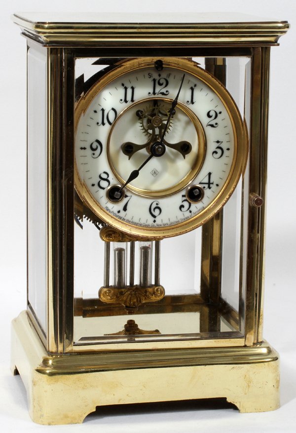 ANSONIA CLOCK COMPANY MANTLE CLOCK: ANSONIA CLOCK COMPANY, MANTLE CLOCK, H 10", W 5", L 6":brass frame, clear glass panels, enamel face, Arabic numerals; two key wind, mercury weighted pendulum;