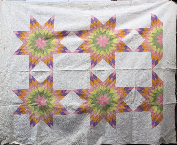 LONE STAR QUILT CIRCA 1890 TO 1925: LONE STAR QUILT CIRCA 1890 TO 1925 W 68" L 82":Handmade quilt lone star pattern circa 1890 to 1925. This quilt has been pieced together and quilted by hand. The only machine stitching is along the are