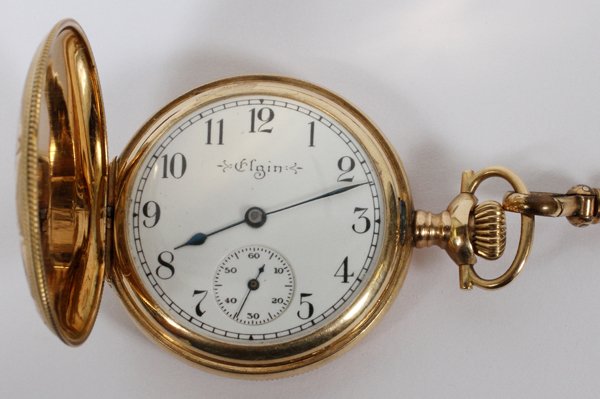 ELGIN 14KT GOLD HUNTER CASE POCKET WATCH C. 1910: ELGIN 14KT YELLOW GOLD HUNTER CASE POCKET WATCH, C. 1910:Serial number 14331653. Having Arabic numerals and a seconds dial. Accompanied by a 49" unmarked gold tone chain with jade and seed pearl accen
