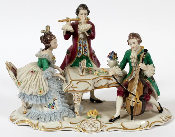 FRANKENTHAL DRESDEN LACY PORCELAIN FIGURAL PLATEAU: FRANKENTHAL, DRESDEN LACY PORCELAIN FIGURAL PLATEAU, THREE MUSICIANS, C. 1930, H 7", W 11":Depicting two male figures playing the flute and cello, and one female figure playing the piano. Made in Germ