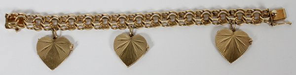 14 KT GOLD ENGRAVED HEART CHARM BRACELET: 14 KT GOLD ENGRAVED HEART CHARM BRACELET, L 7 1/2":Total weight is approximately 49.5 grams.