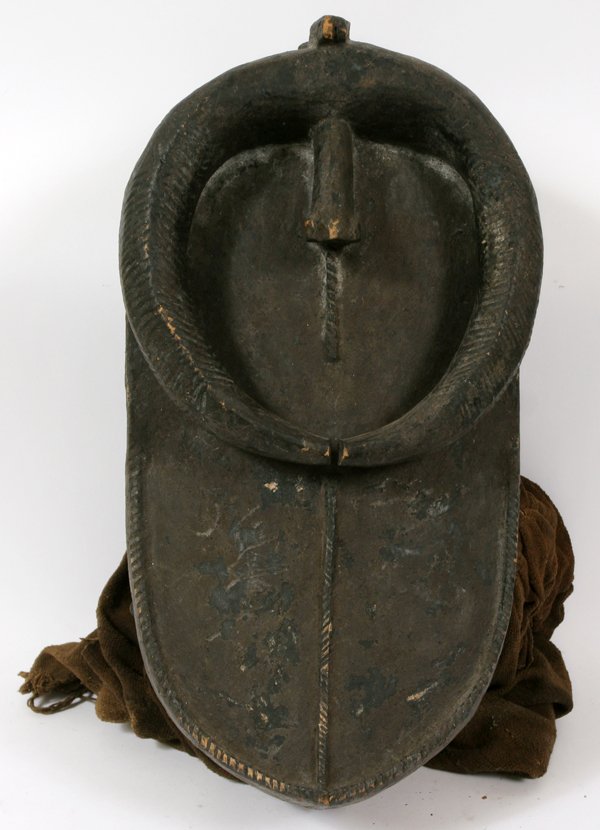 AFRICAN TOMA INITIATION TRIBAL MASK: AFRICAN TOMA INITIATION TRIBAL MASK, H 21" W 11":From the Toma tribe. Used for male initiation. Having the mouth of a crocodile, with horns protruding down from the forehead. Behind the mask is an att