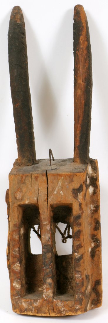 DOGON WILLU CARVED WOOD TRIBAL MASK: DOGON "WILLU", CARVED WOOD TRIBAL MASK, H 23" W 5 1/2": Being of a hollow rectangular form, with large slot eyes, and two raised, slender horns. From the Dogon tribe, Mali. Called the "Willu" or antel