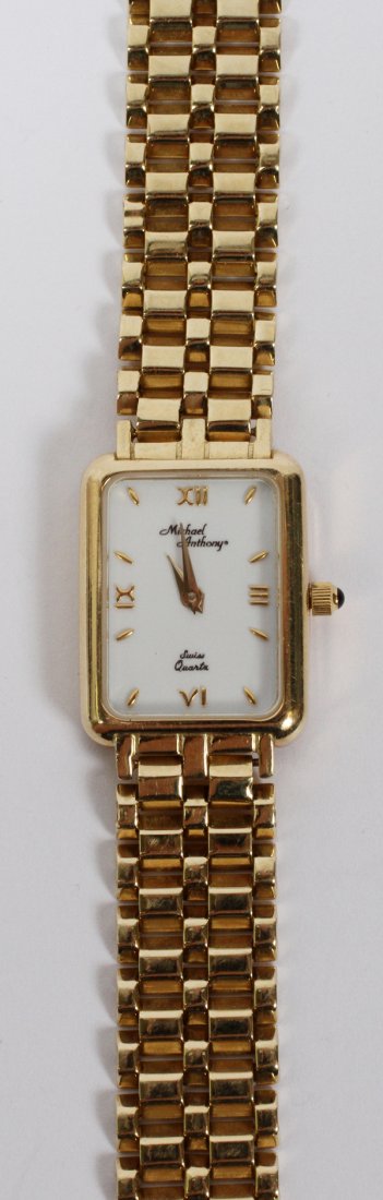 MICHAEL ANTHONY LADY'S QUARTZ 14KT GOLD WATCH: MICHAEL ANTHONY, LADY'S SWISS QUARTZ, 14 KT GOLD WATCH: Total weight 25.8 grams. The watch and band are 14k gold. Good used condition. We neither know nor do we guarantee working order. 7 1/4" long. L