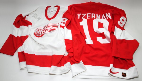 DETROIT RED WINGS SIGNED JERSEYS: DETROIT RED WINGS SIGNED JERSEYS, YZERMAN AND MCCARTY, 2 PCS.:includes one Yzerman autographed Official Nike red home jersey and one CCM replica white away jersey signed by Darren McCarty.