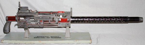 WWII BROWNING MACHINE GUN TRAINER .30 CAL: WWII, BROWNING MACHINE GUN TRAINER, .30 CAL, #M1919A6, H 14 1/2'', L 78'':non-firing, approximately 1 1/2 scale, working/training model BMG (Browning Machine Gun), M1919A6; . Having cut out panels to 