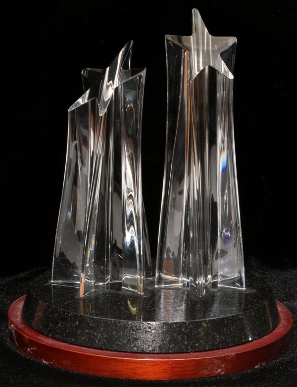 STEUBEN GLASS STAR SCULPTURE BY JOEL A. SMITH: STEUBEN GLASS STAR SCULPTURE BY JOEL A. SMITH, 1997, H 8":Two star shapes on a base, signed and numbered 63/90, designed for Neiman-Marcus 30th anniversary Atlanta store celebration.