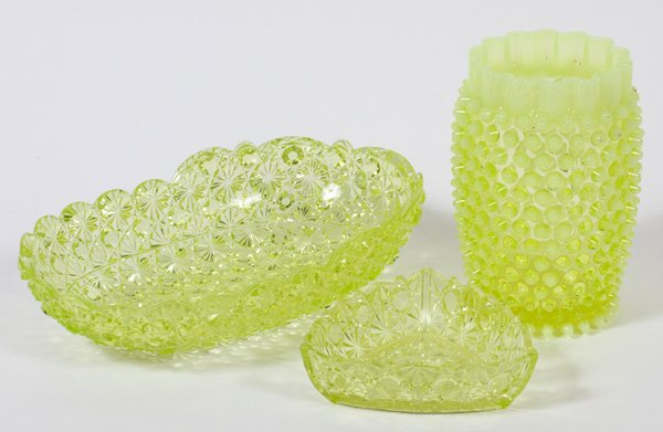 VASELINE GLASS TABLE WARE C. 1870 THREE PIECES: VASELINE GLASS TABLE WARE, C. 1870, THREE PIECES:Including 1 hobnail vase, H.6" (smooth pontil), 1 Daisy & Button bowl, L.10" x 6", and 1 triangular dish, W.4" (rough edge).