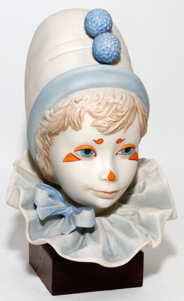 CYBIS BISQUE HEAD OF A CLOWN: CYBIS BISQUE HEAD OF A CLOWN, H 9 1/2":Signed, impressed 1976, mounted on a wood base, H.9 1/2" overall.